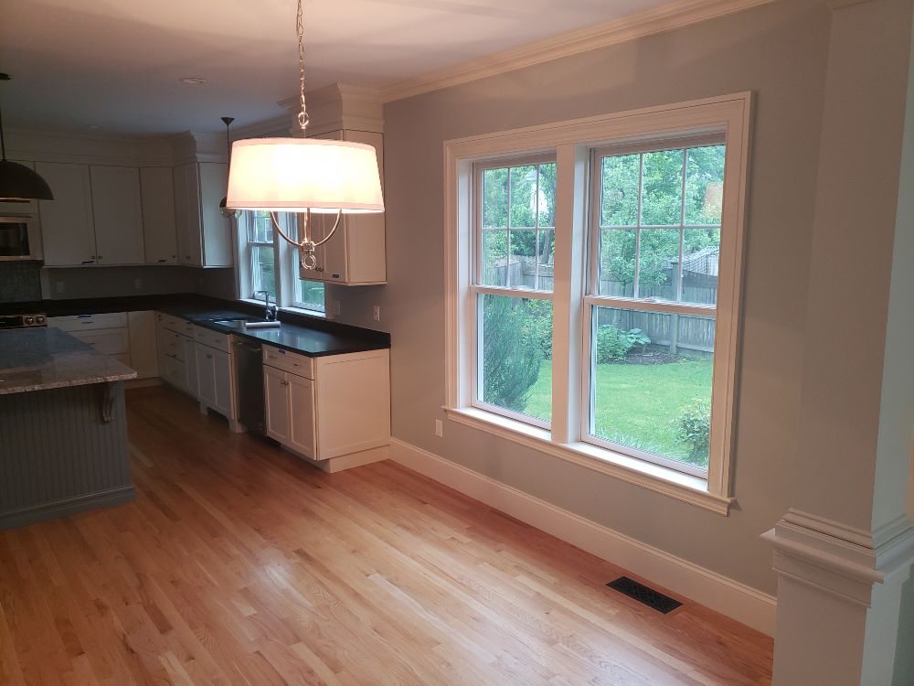 A freshly repainted kitchen with vibrant colors and a modern, clean look, expertly finished by Impeccable Painting.