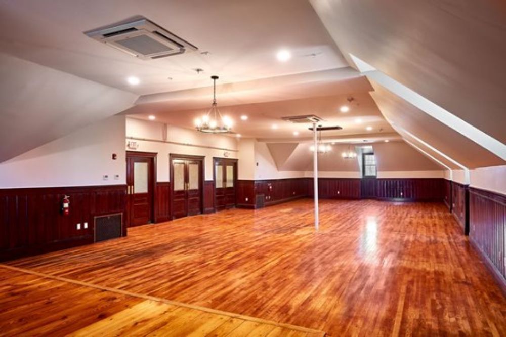 A freshly repainted commercial event room with a polished, modern color scheme that enhances the space for events and gatherings, painted by Impeccable Painting.