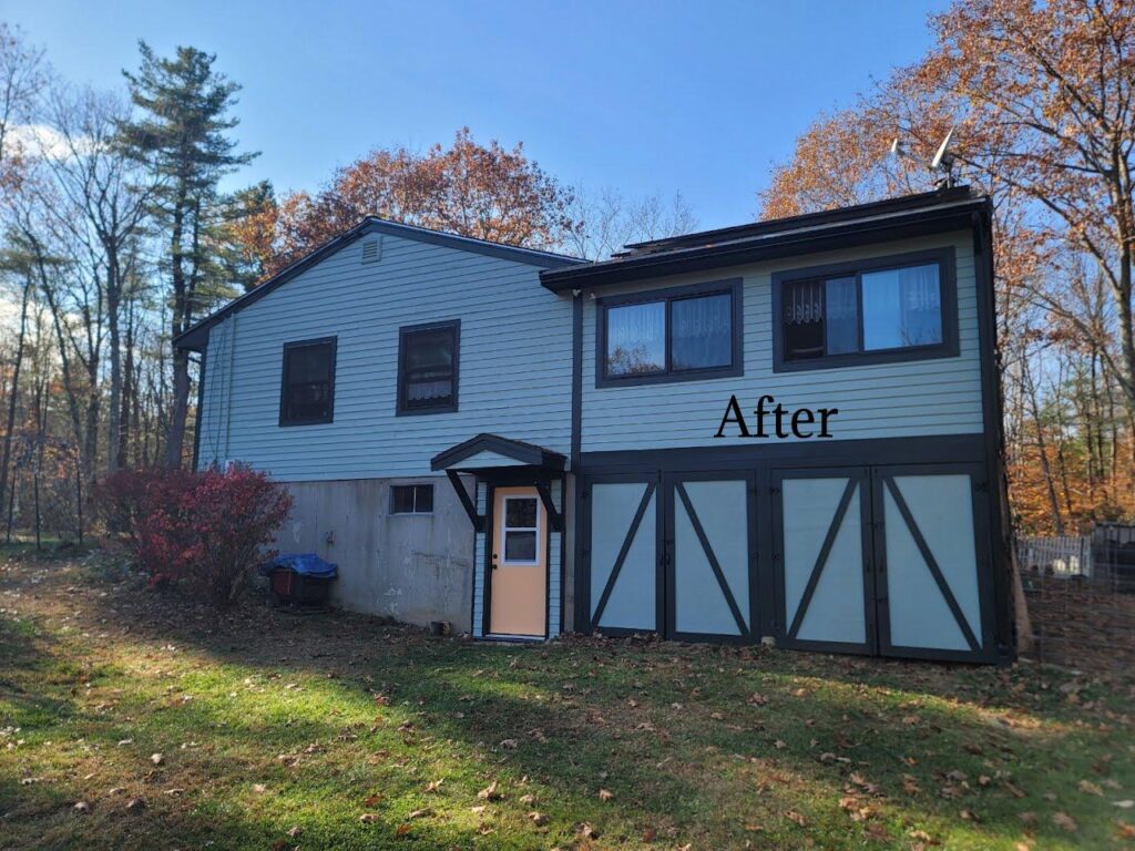 A beautifully restored New England home with a rich green exterior, a vibrant yellow door, and elegant dark green trim by Impeccable Painting.